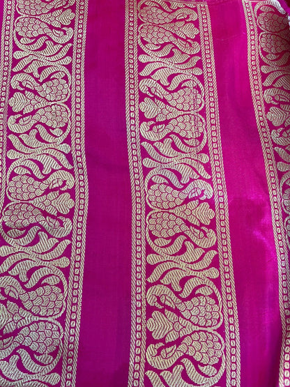 Pink fabric with intricate gold patterns